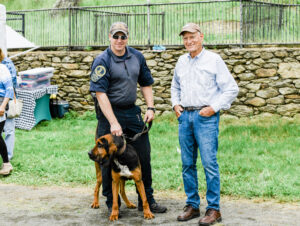 K-9 bloodhound with handler at Dog Daze event