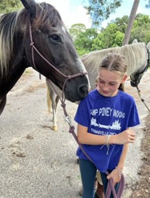 Young girl with horse